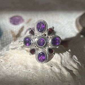 925 sterling silver ring with amethyst and garnet colored stones.